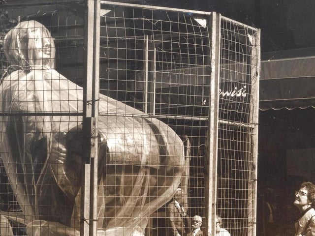 This 10ft tall statue swathed in plastic and protected by a wire cage is the Dortmund Drayman pictured in September 1980. It was a gift from the city of Dortmund to commemorate the 10th anniversary of the twinning of the two cities