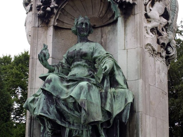 The statue of Queen Victoria on Woodhouse Moor pictured in July 2000. The memorial consists of figures and a frieze in bronze on a plinth and pedestal of Portland stone.