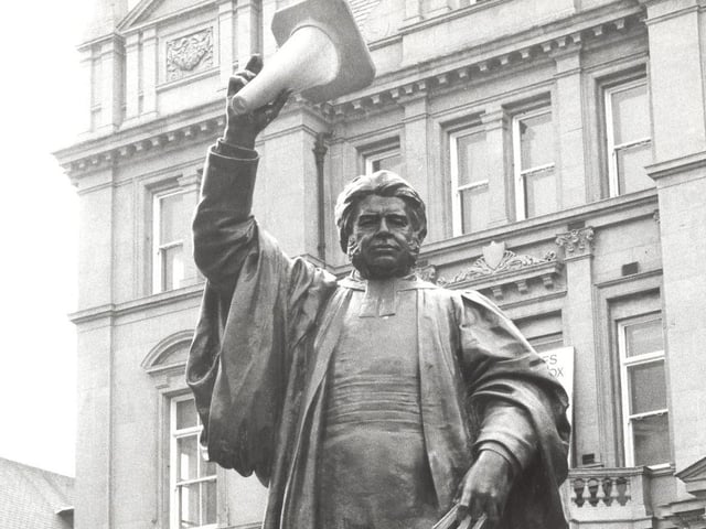 Dr Walter Hook, former Vicar of Leeds and champion of workers' rights go to grip with another social cause. This time its a silent protest at no-parking areas in July 1978. The raised hand become a warning gesture to traffic wardens.