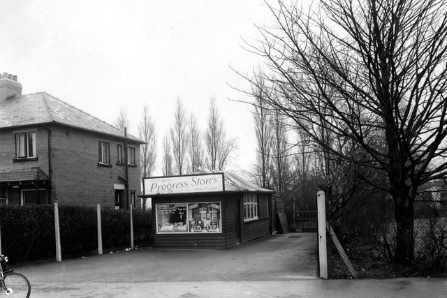 Progress Stores, a small grocers shop on King Lane pictured in January 1955, selling tinned and packet goods and fresh provisions. Window stickers advertise butter, bacon and eggs.