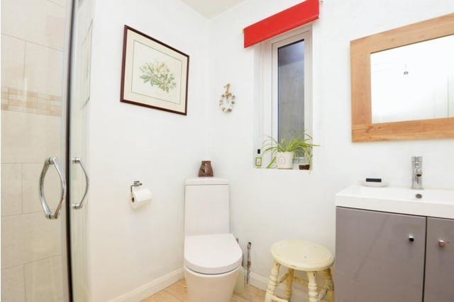 The house shower room comprises of basin, toilette and walk in shower.