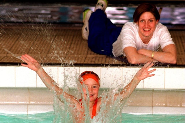 Former Olympic and Commonwealth swimmer Suki Brownsdon watches Jonathan Plows make a splash at the Morley Leisure Centre. He was one of hundreds of local schoolchildren taking the plunge to help raise £200,000 to send British athletes to the 1996 Olympics.