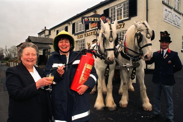 The Travellers Rest pub at East Keswick reopened after a fire. Pictured with landlady Jenny Pashley is Pat Briggs who lived at watering hole between 1924 and 1934.