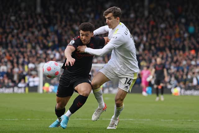 Che Adams holds off the challenge of Diego Llorente. pic: Marc Atkins.