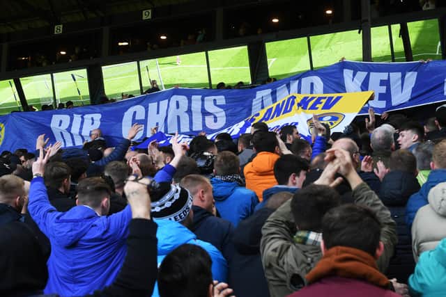 Leeds 
United's fans pay tribute to Chris Loftus and Kevin Speight at Elland Road on Saturday.
 Picture: Jonathan Gawthorpe.