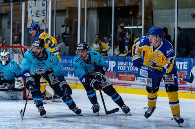 POST-SEASON: Kieran Brown (right) is challenged by Sheffield Steeldogs Matt Bissonnette (left) and Ben Morgan on Sunday night. Picture courtesy of Oliver Portamento.
