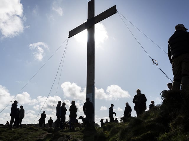 The crisp spring morning made for a stunning image at the cross was put up