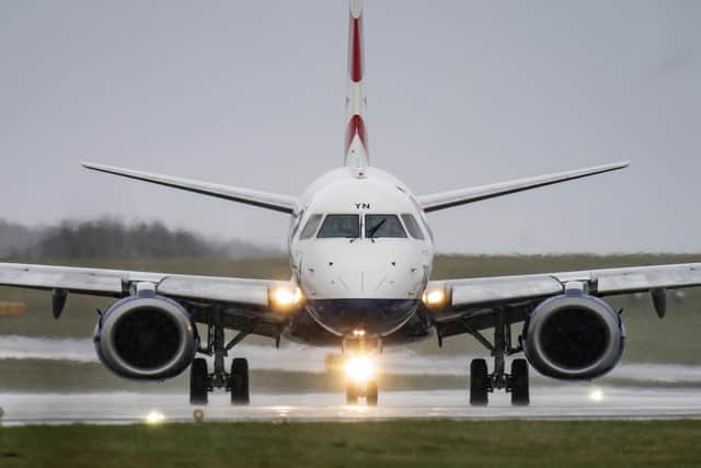 Flight BA7313 from Belfast City, lands in rainy and windy conditions at Leeds Bradford Airport in Yorkshire.