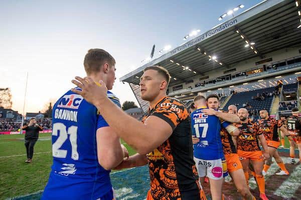 Morgan Gannon with Castleford's Greg Eden after Rhinos' recent Cup defeat. Picture by Allan McKenzie/SWpix.com.
