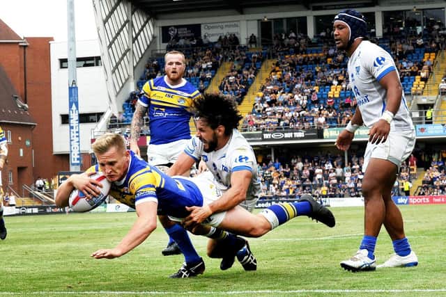Brad Dwyer scores for Rhinos against Toulouse in 2018. Picture by Steve Riding.