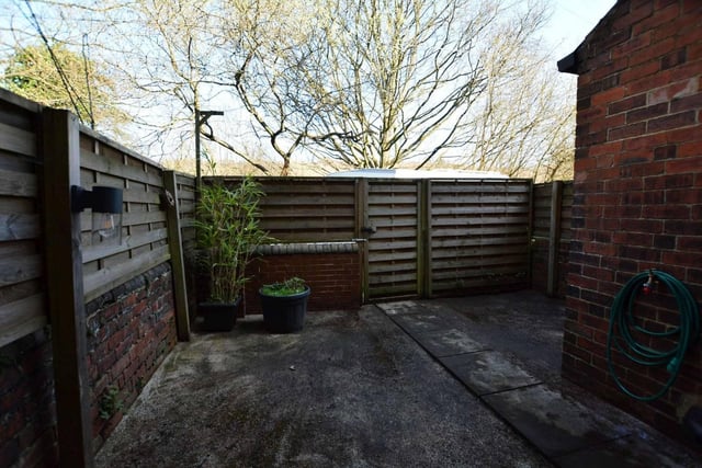 There is a door leading from this room out onto the fence enclosed rear yard and countryside beyond.