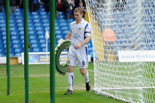 3rd April 2010....Leeds United v Swindon Town....Leeds captain Richard Naylor lays a wreath for Kevin Speight and Christopher Loftus