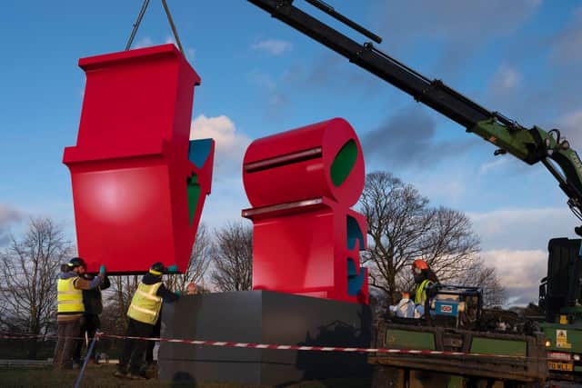 Installing Robert Indiana, LOVE (Red Blue Green), 1966–1998. Photo © Jonty Wilde, courtesy of Yorkshire Sculpture Park