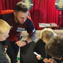 Joe Cullen with Park Spring pupils during their Bullseye Maths session.