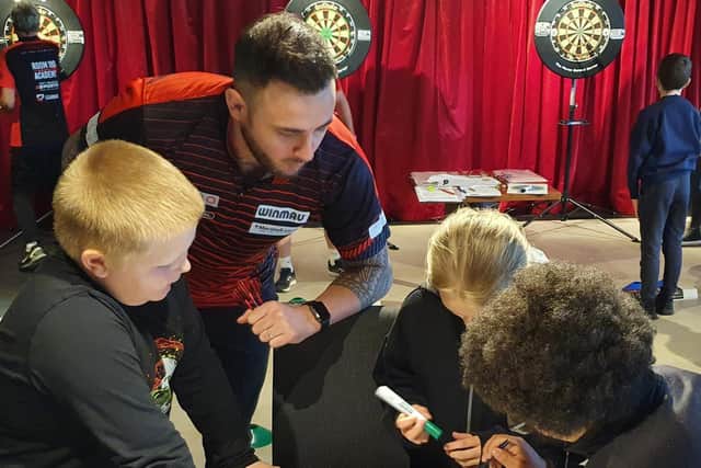 Joe Cullen with Park Spring pupils during their Bullseye Maths session.