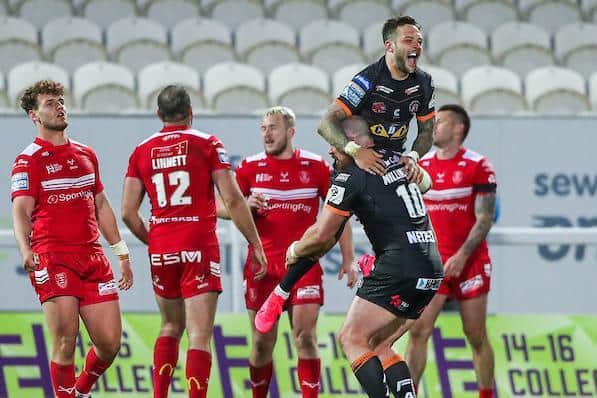 Gareth O'Brien celebrates with Grant Millington (number 10) after his drop goal secured Tigers' Cup win at Hull KR last year. Picture by Alex Whitehead/SWpix.com.