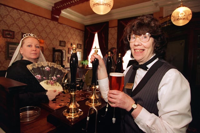 Pictured is Bridget McGourty at the Victoria public house on Great George Street,  handing over a pint of Tetleys to a Queen Victoria look-alike in 1998.