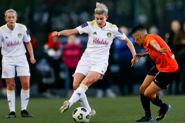 Leeds United midfielder Sarah Danby is pursued by Brighouse Town's Caz Fields. Pic: LUFC.
