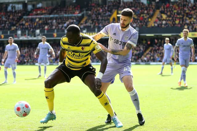 Watford midfielder Moussa Sissoko holds of Mateusz Klich. Pic: Alex Morton.