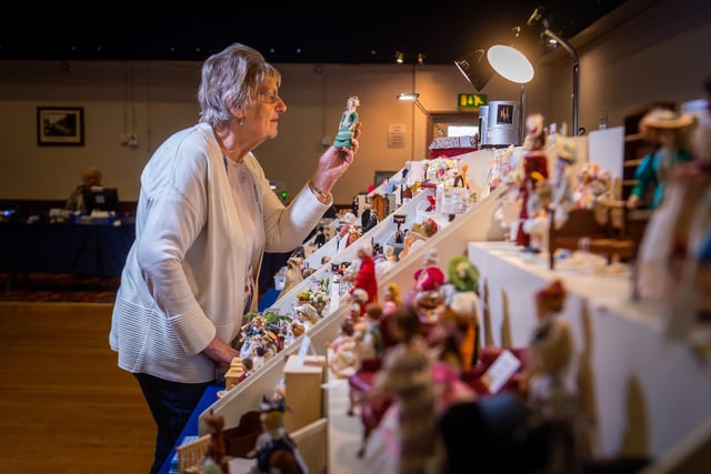 Doreen Vincent, former fair organiser, owner of Small Wonders Miniatures in Idle, Bradford, sets up her stall before the doors open to the public.