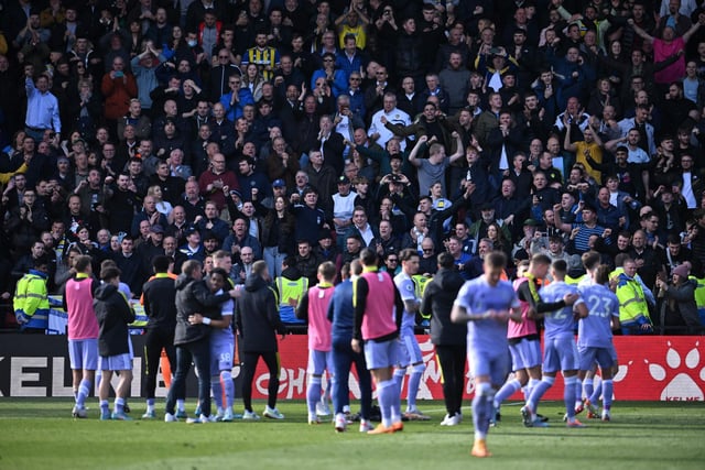 In the away end as Leeds United celebrate their victory. 
Photo by BEN STANSALL/AFP via Getty Images.