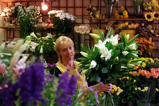 This is Karen Lamb owner of Flowers by Karen in Guiseley. She was celebrating in July 1999 after being inducted into the American Institute of Floral Designers.