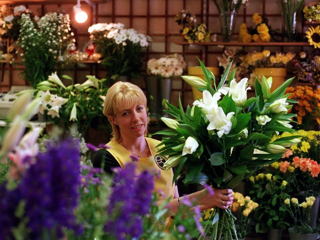 This is Karen Lamb owner of Flowers by Karen in Guiseley. She was celebrating in July 1999 after being inducted into the American Institute of Floral Designers.