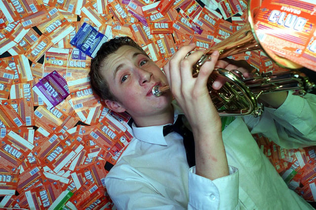 Cornet player Mark Howorth celebrates pupils at Guiseley School eating 17,000 chocolate bars in exchange for musical instruments.