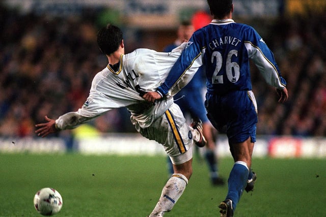 Harry Kewell has his shirt pulled back by Chelsea's Laurent Charvet.