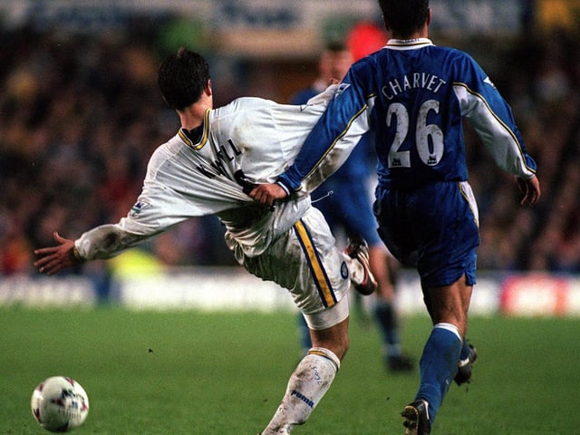 Harry Kewell has his shirt pulled back by Chelsea's Laurent Charvet.