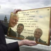 Colin Pullan wih a plaque in 2001, which recognised Take Heart's raising £1m for the Hospital.