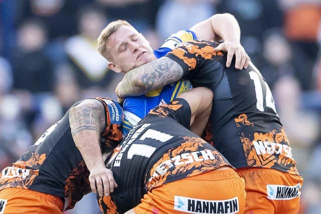 Leeds Rhinos hooker Brad Dwyer is swamped by Castleford Tigers players during the recent Challenge Cup encounter. The sides meet in Super League on Easter Monday. Picture: Allan McKenzie/SWpix.com.