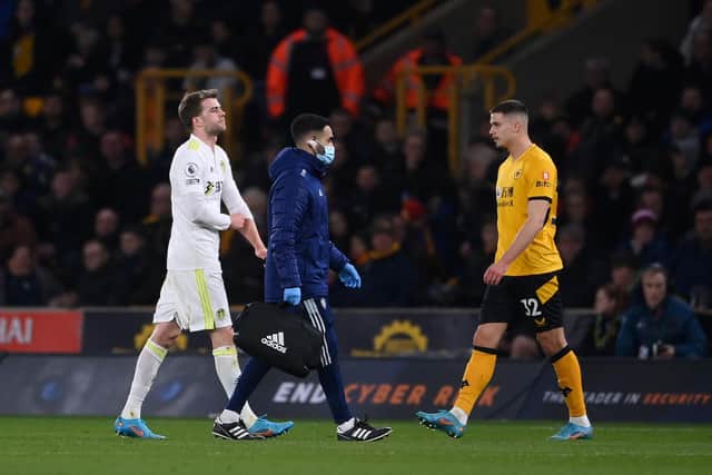 Leeds United striker Patrick Bamford limps off at Molineux. Pic: Laurence Griffiths.