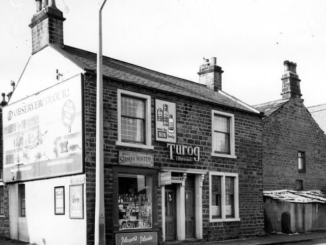 A grocers and tobacconists on Town Street pictured in March 1965. The window is also crowded with glass jars of sweets. It was the business of Stanley Winter who lived next door.