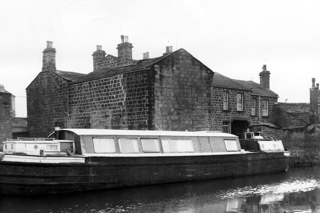 A barge is moored on the Leeds and Liverpool Canal in February 1965. In the background properties fronting onto Town Street are visible. At 127 miles, the Leeds and Liverpool Canal is the longest in Britain. Work began in the 1770s with the canal becoming fully operational in 1816.
