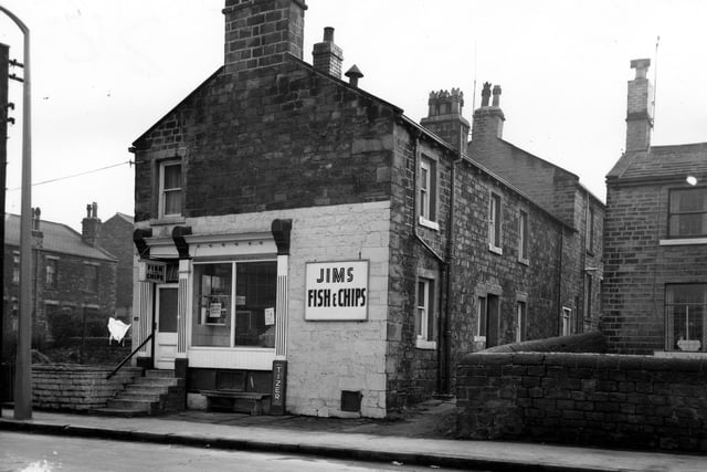 Jim's fish & chip shop on Town Street pictured in March 1965. This property also had an entrance facing onto Kirkham Street. A sign in the window states 'Wet Fish Sold Here, Haddock'. Outside the shop is a wooden bench next to a Tizer advertisement.