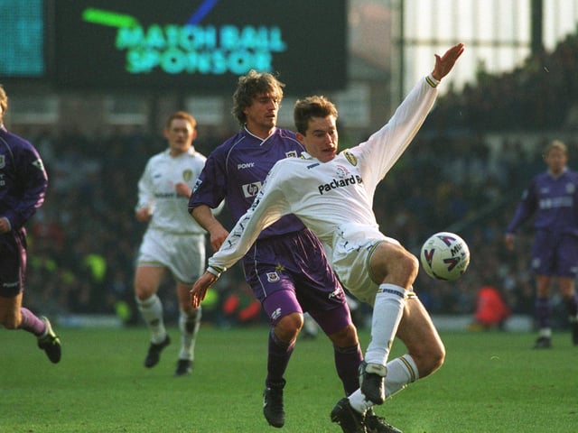 David Wetherall shoots at goal watched by Tottenham's David Ginola in the FA Cup tie at Elland Road.