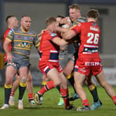 Castleford Tigers' Joe Westerman is stopped by the Hull KR defence. Picture: Bruce Rollinson.