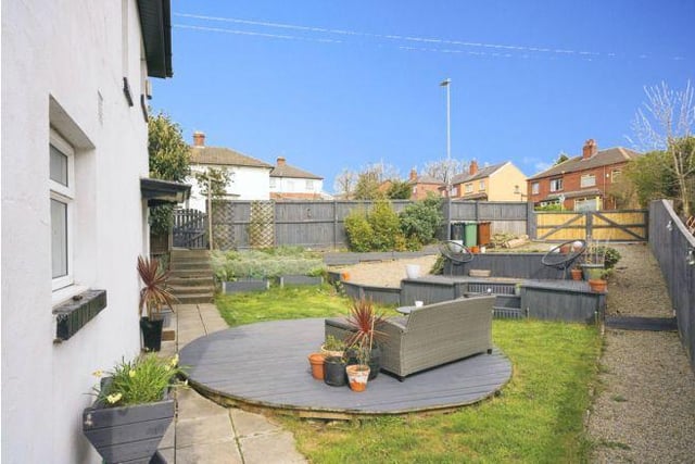 The garden is a great size with a gated gravelled driveway for two cars which leads to a decking area and then a low maintained lawned area with surrounding shrubs and plant borders.