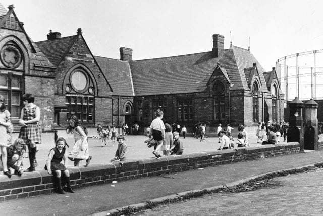 Pupils in the playground at Sheepscar School pictured in June 1968. The gasometer in the background.
