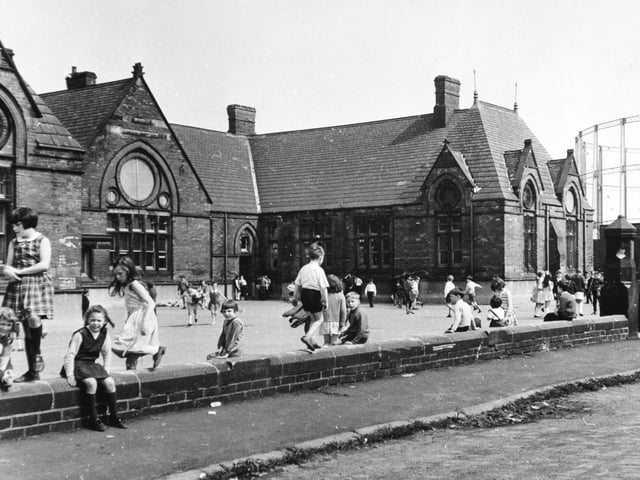 Pupils in the playground at Sheepscar School pictured in June 1968. The gasometer in the background.