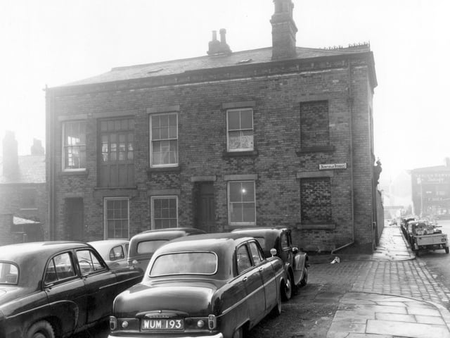 Cars parked in the foreground of this view stand where the odd numbered side of Renfield Street was before slum clearance. Pictured in January 1961.
