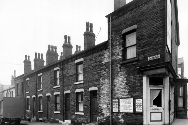 Houses on Enfield Road in February 1961. On the corner is the premises of H.G. Hosiery Co.