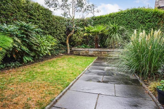 Gardens wrap round the front and side of the property and are laid to lawn with a slate patio area are surrounded by mature hedging.