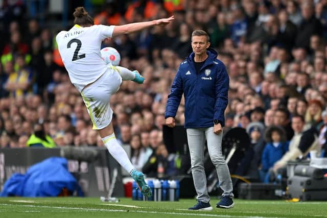 Luke Ayling is at full stretch to keep the ball in while Leeds United boss Jesse Marsch looks on. Pic: Michael Regan.