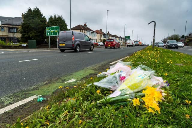 Residents have been at the scene of the crash today and floral tributes have been laid. Picture: James Hardisty.