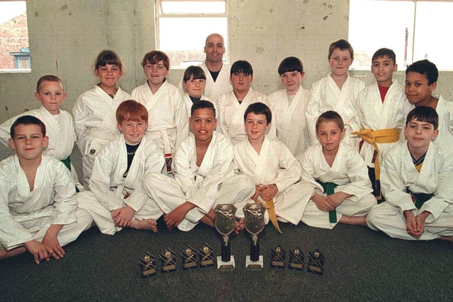 Sensei Carl Herbert with the members of the Ken Toh Kai Karate Club in Leeds. The group took part in the North East Open Championships, winning a host of trophies.