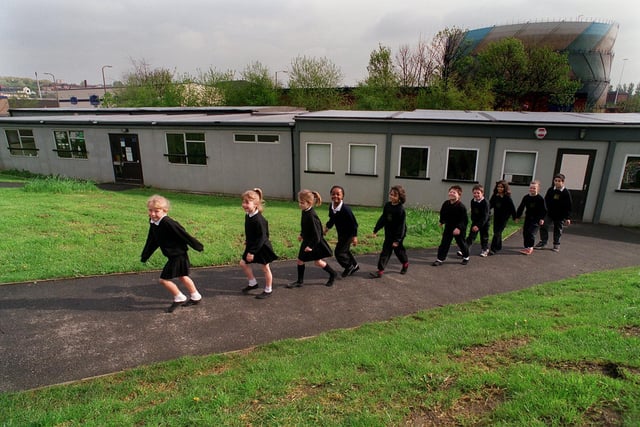 Pupils leave temporary classrooms at Little London Primary School.