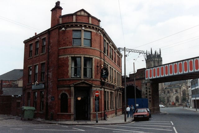 The Duck & Drake public house at bottom of Kirkgate. Railway bridge can be seen on the right with St Peter's Church tower visible in the background.