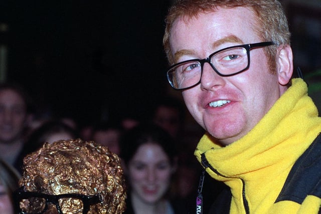 New Virgin Radio boss Chris Evans holds a model head of himself during the a special charity shop sale held at Harvey Nichols in December 1997.